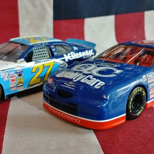Blue diecast NASCAR-style race car with #27 and ThunderBird graphics