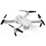 RC quadcopter drone with 4 propeller blades and front camera, white body