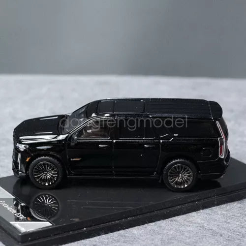 Black 1:64 scale Cadillac Escalade ESV diecast model car with wheels, side view
