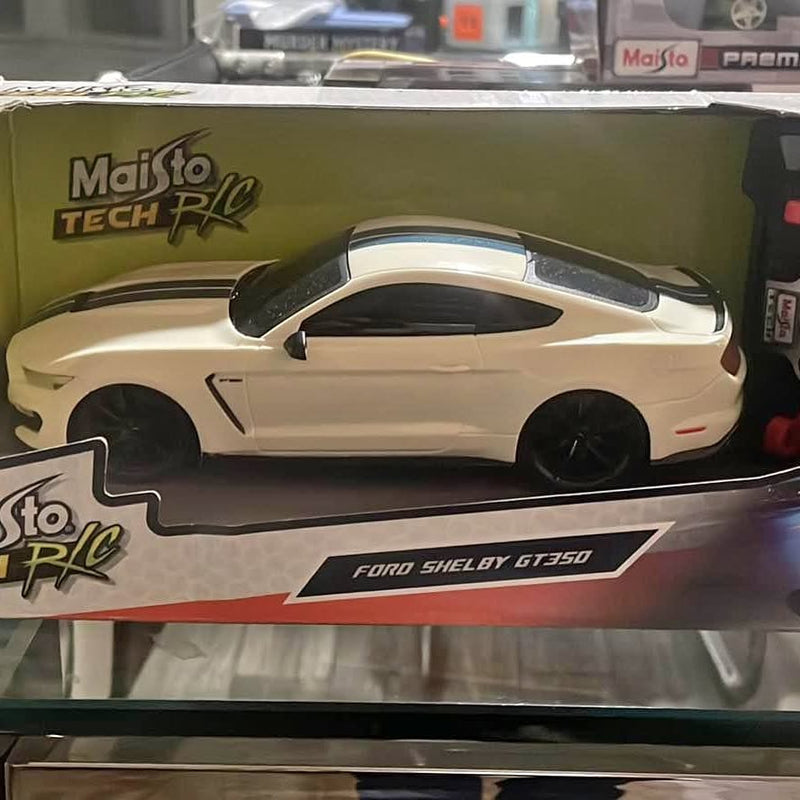 White diecast toy car with black wheels, Ford Shelby GT350 on box