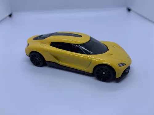 Yellow and black diecast sports car model with black hood