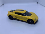 Yellow and black diecast sports car model with black hood
