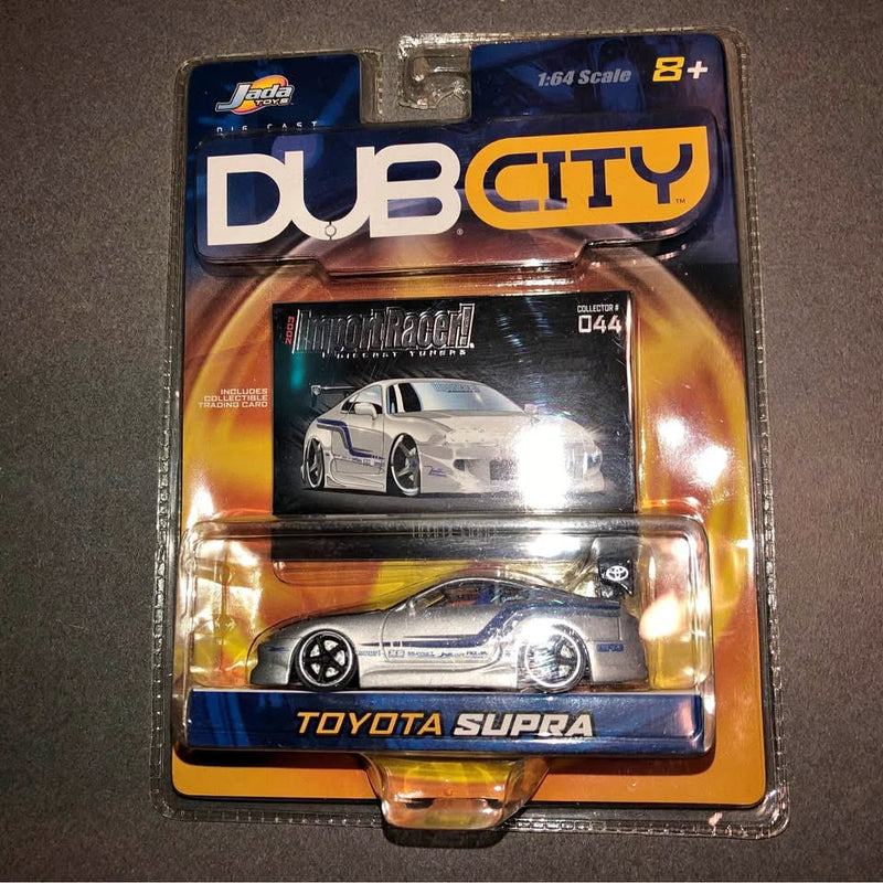 1:64 diecast toy car of Toyota Supra in blue on Jada Dub City blister packaging