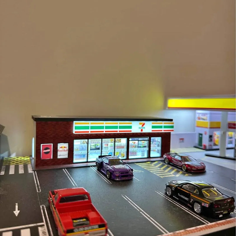 Light-up 1:64 diecast diorama with lit convenience store sign and parked cars