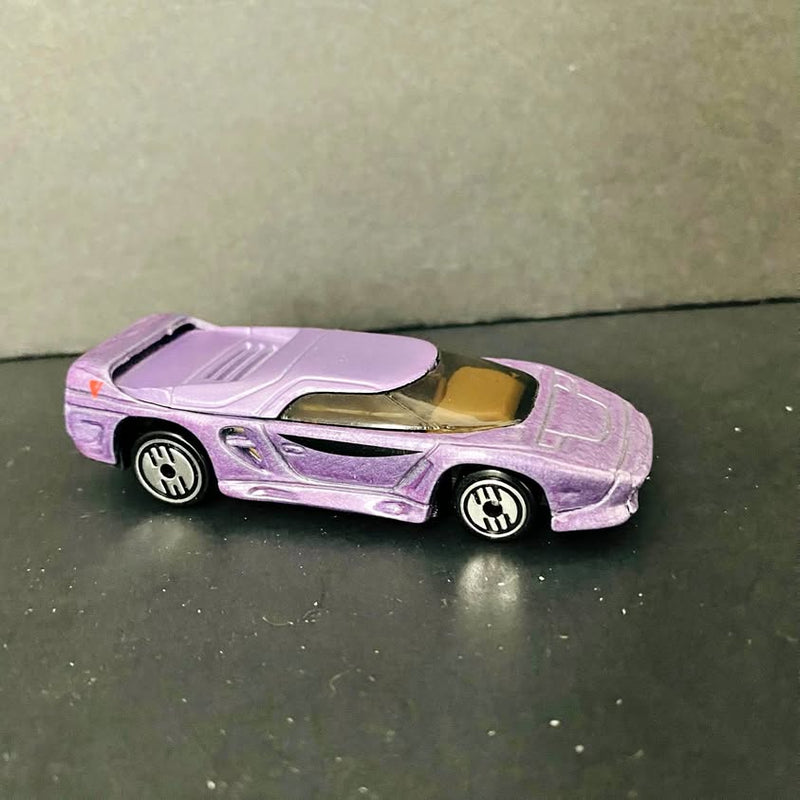 Purple vintage diecast car with detailed decals and silver wheels