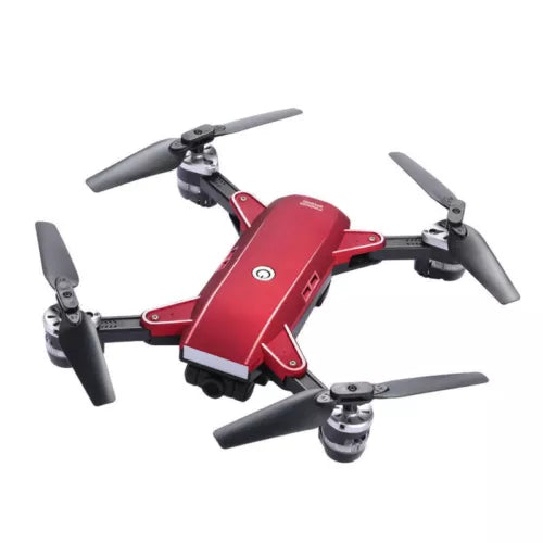 Red foldable quadcopter drone with four propellers and compact body