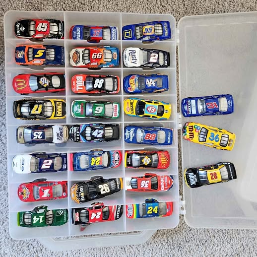 Nascar 1/64 diecast car set in clear organizer, multiple race cars