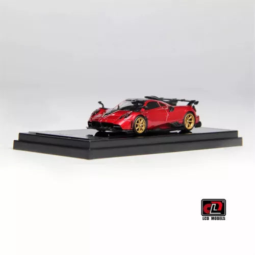 1:64 Pagani Imola diecast model car, red with black hood, on black display base