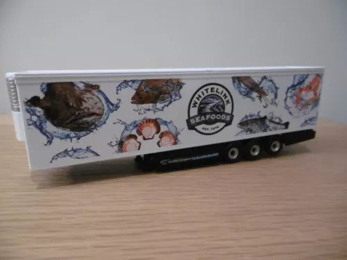 Diecast fridge trailer in Whitelink Seafoods livery, side view with wheels and branding