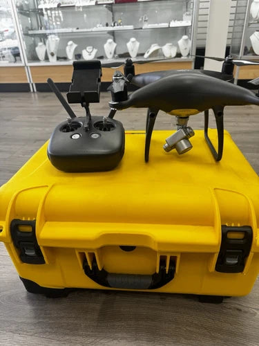 DJI Phantom 4 Pro drone bundle with yellow carry case, controller and batteries