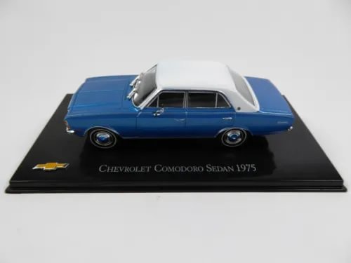 Blue 1975 Chevrolet Commodore sedan diecast car, on display base.