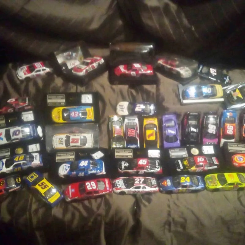 1:24 scale NASCAR diecast car set, multiple cars with number decals
