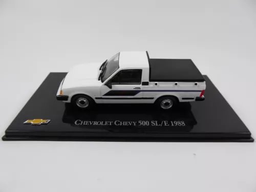 White and black diecast model car on display base, side profile
