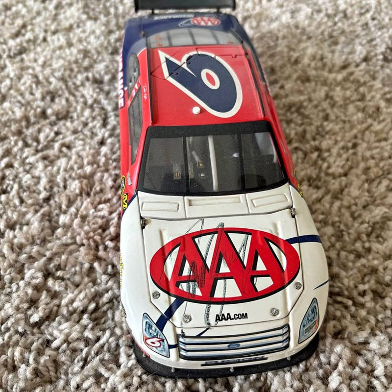 Red and white NASCAR diecast car with hood graphics and front windshield