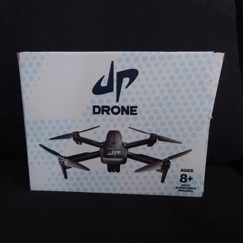 Camera drone in retail box with four propellers