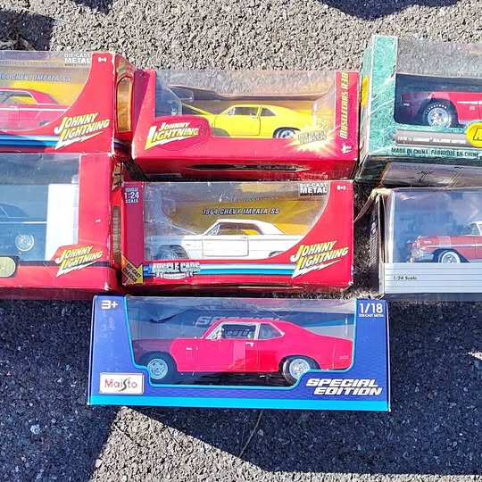 Johnny Lightning 1:24 diecast car set in retail boxes, red and pink cars