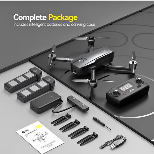 GPS camera drone kit with controller, batteries, and spare propellers