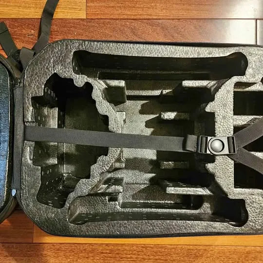 Drone backpack case interior foam insert with fitted compartments and straps
