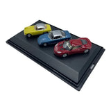 Diecast car set with three Lotus models in yellow, blue, and red on black base