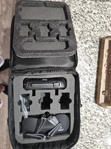 Foldable quadcopter drone in protective hard case with foam cutouts
