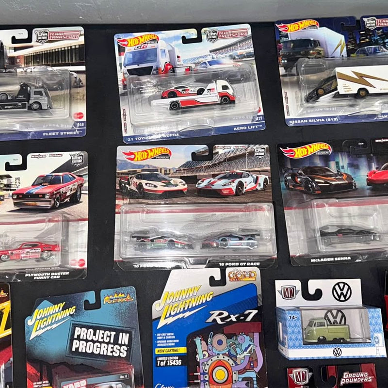 Diecast toy cars in blister packages on retail cards