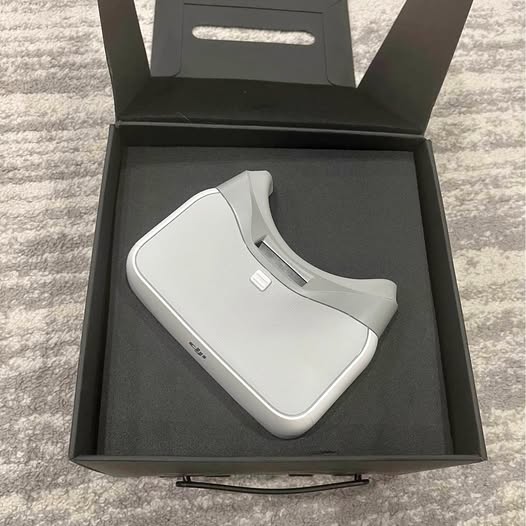 White FPV goggles headset with curved face padding, shown in a gift box.