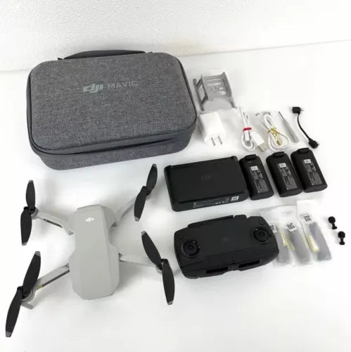 Foldable quadcopter drone kit with carrying case, controller, batteries, and accessories