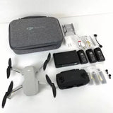 Foldable quadcopter drone kit with carrying case, controller, batteries, and accessories