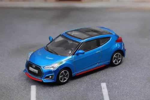 1/64 scale blue Hyundai Veloster Turbo diecast car model toy, front three-quarter view