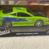 Hot Wheels diecast car, lime green Mitsubishi Eclipse with hood graphics and chrome wheels in box