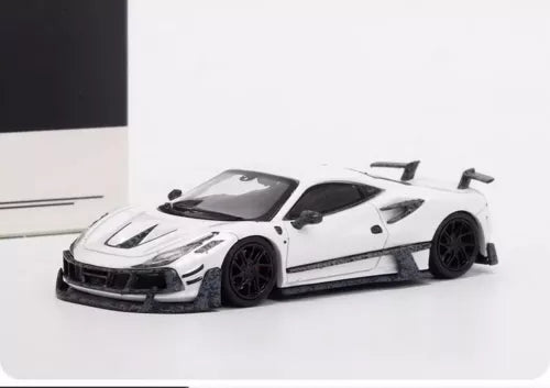 1/64 white diecast sports car model with black wheels and aero kit, front 3/4 view