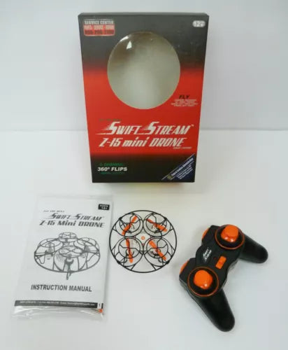 Mini RC drone with black controller, instruction manual, and prop guard in box