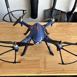 Blue MJX BUGS 3 drone with four propellers