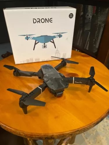 Black quadcopter drone with four rotors, ready-to-fly body