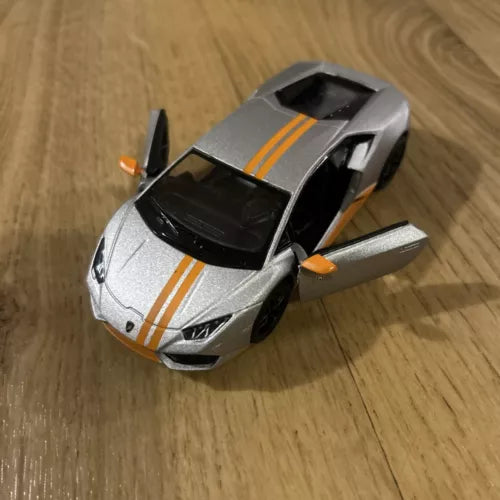 Silver diecast toy car with black top and orange racing stripes, front doors open