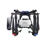 Agricultural spray drone with four arms and front spray tank, landing legs.