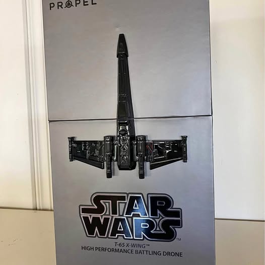 Black Star Wars battle drone, front view with four wing panels and propeller