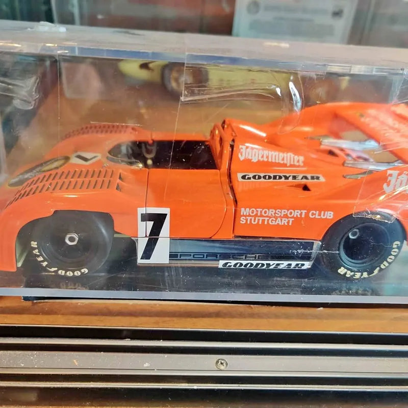 1/18 diecast race car model, orange with number 7 and Goodyear branding