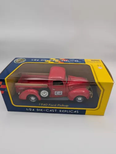 Red 1940 Ford pickup diecast replica in 1:24 box, with opening window display
