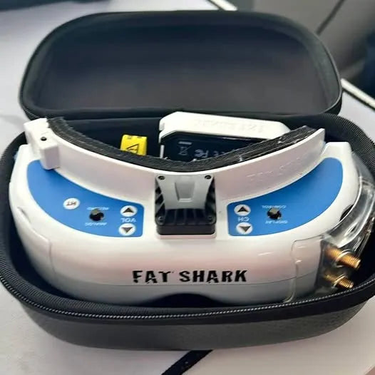 Fat Shark FPV goggles with blue control panels in hard carrying case