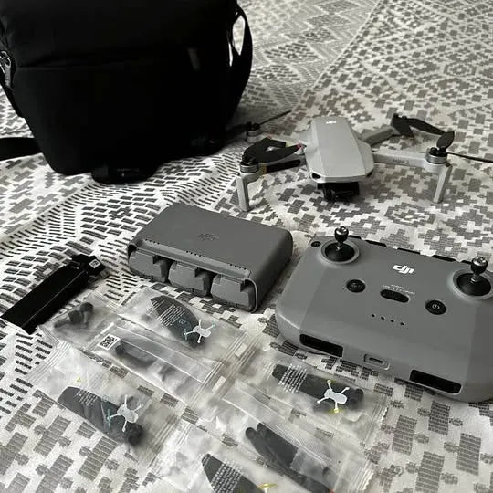 DJI drone with landing gear and propellers, top view