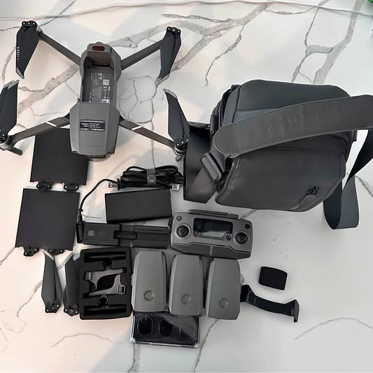 DJI Maverick Pro 2 drone with controller and spare parts, black and gray