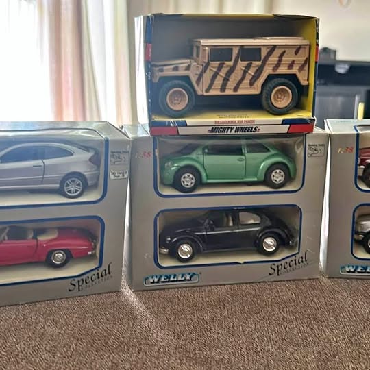 Vintage diecast car in box with green top car and black bottom car, unopened