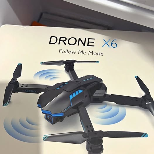 Black quadcopter drone with blue accents and foldable arms
