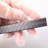 3K carbon fiber fabric strip, dark gray twill weave with fine rectangular pattern