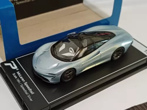 McLaren Speedtail silver diecast model car on black display base