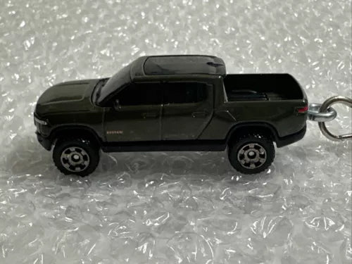 Diecast pickup truck keychain, dark green, side view with metal keyring