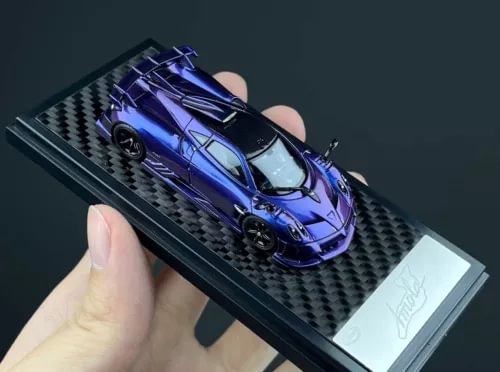 1:64 scale purple sports racing diecast car in display box, detailed front view