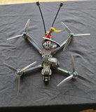 FPV quadcopter drone with four propellers and compact controller stack