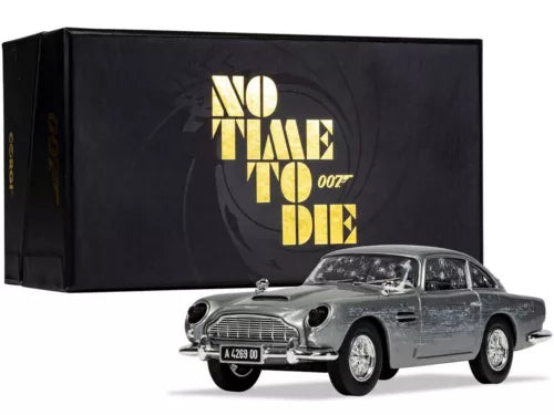 Aston Martin DB5 damaged silver diecast toy car, front 3/4 view